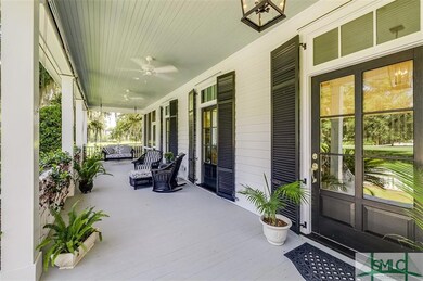 Porch has both fans and sun shades.