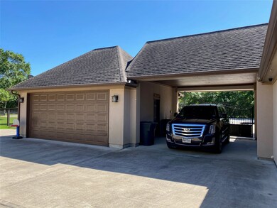 2 car garage that is insulated and sheet rocked, cooled with a plug in AC un it to keep it climate controlled. Porte-cochere for parking that has immediate access to the mudroom side entry.