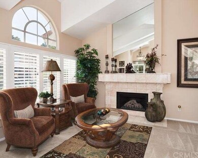 Formal Living with plantation shutters and firepla