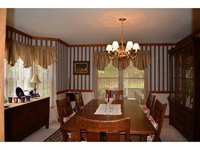 Dining Room. Featuring crown molding, chair rail a