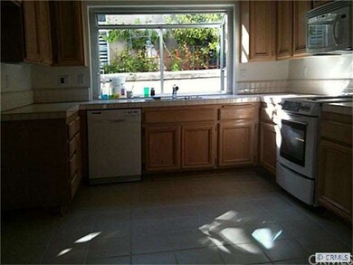Bright kitchen with garden window. New tile floor.