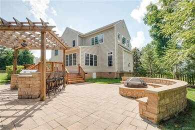 Outdoor retreat at extensive paver patio with kitc