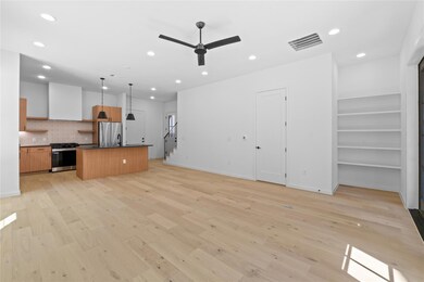 Unfurnished living room featuring light wood-styl