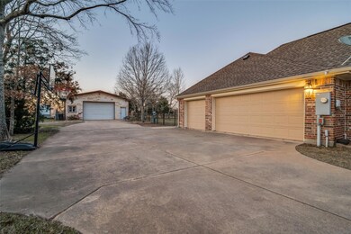 3 car garage and view of shop.