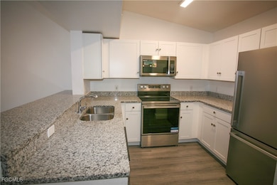 Kitchen featuring stainless steel appliances, loft