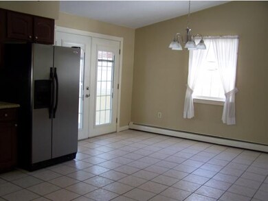 French doors lead to sunroom