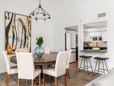 Dining space with a high ceiling, wood finished f