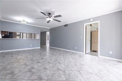 Unfurnished living room featuring baseboards, visi