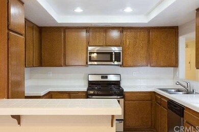 Roomy kitchen with new stainless steel microwave, 
