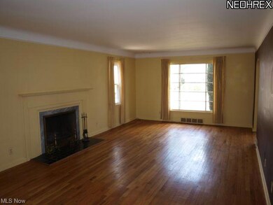 Spacious living room with wood burn fireplace and 
