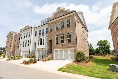 Multi unit property featuring driveway, brick sidi