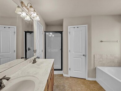 Bathroom featuring vanity, tile patterned floors, 