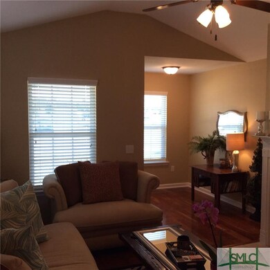 Great Room features hardwood flooring, cathedral c