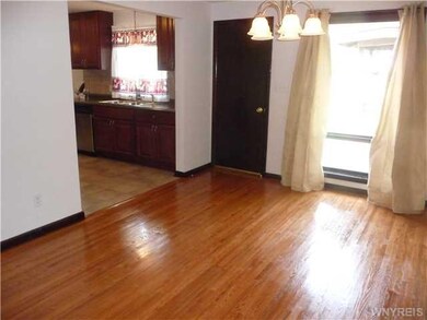 Dining Room. Dining rm off kitchen, gleaming hardw