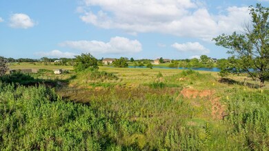 View of undeveloped land with a nearby body of water