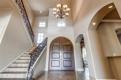 This 2 story foyer with decorative windows provide