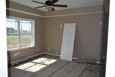 Master bedroom with trey ceiling and attached bath