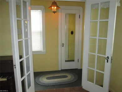 Foyer with guest closet.