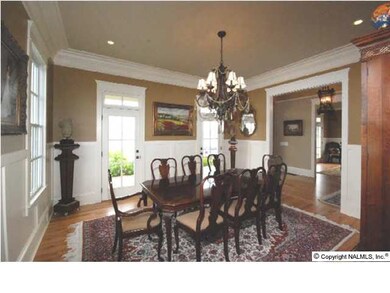 THE FORMAL DINING ROOM IS 15 X 14 WITH HARDWOOD FLOORS, WAINSCOTING AND HEAVY CROWN MOLDING. THERE ALSO IS RECESSED LIGHTING