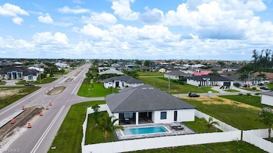 Aerial view of residential area featuring a pool