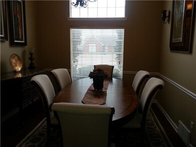 Spacious Dinning room hardwood floors arched entry