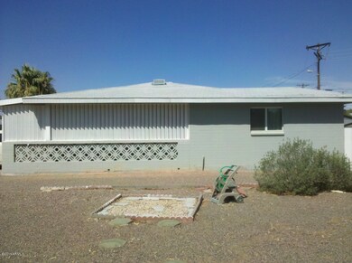 Carport has large workshop/laundry room