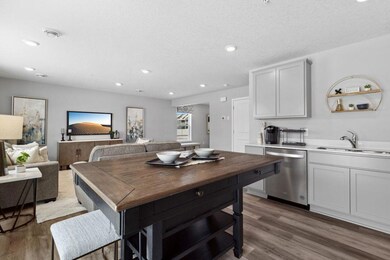 Open concept living with many ways to arrange furniture. Photo is of model home. Colors and options may vary. Ask Sales Agent for details.