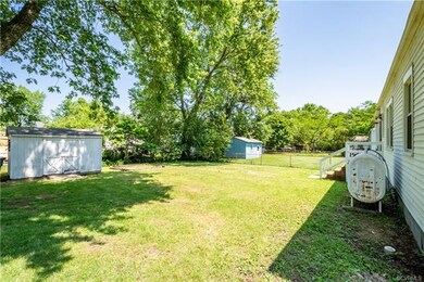 View of the back yard and detached shed.