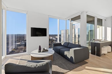 Living room with a wall of windows, wood finished
