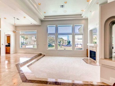 Living Room. Sunken living room with plush carpet