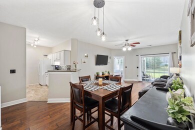 Dining area with wood-type flooring, sink, and cei