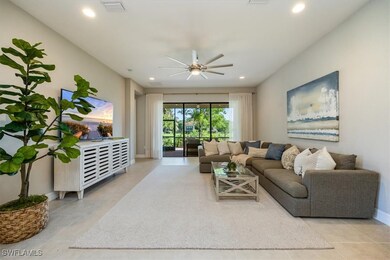 Tiled living area with ceiling fan, recessed light