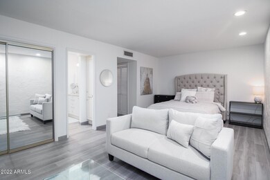 Primary bedroom w/ sitting area
