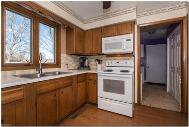 Kitchen view 2 - kitchen leads to oversized laundr