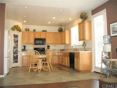 Kitchen and backdoor to pool-sized lot.