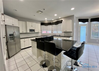Black granite kitchen with island.
