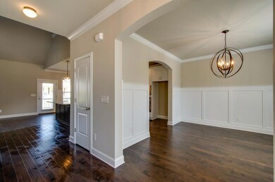 Open Plan with crown molding all hardwood floors. These are not actual pictures of home under construction