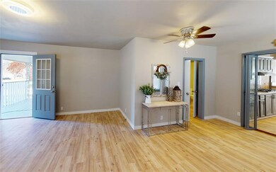 Empty room with light hardwood / wood-style floors