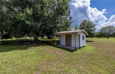 View of yard with a storage shed