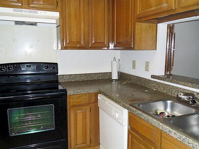 Kitchen has recent smooth top stove.