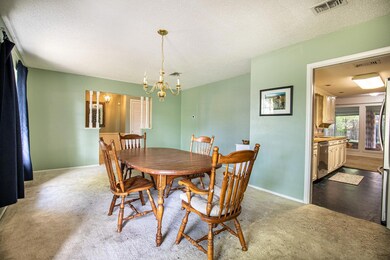 Dining area featuring a chandelier, visible vents,