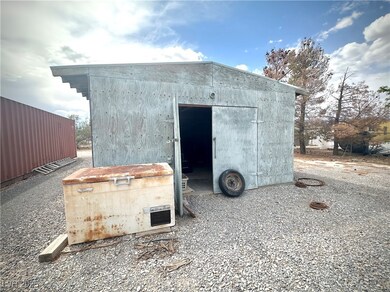 View of outdoor structure with an outbuilding