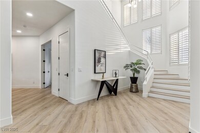 Entryway featuring wood finished floors, baseboard