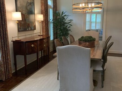 Dining space featuring an inviting chandelier, par