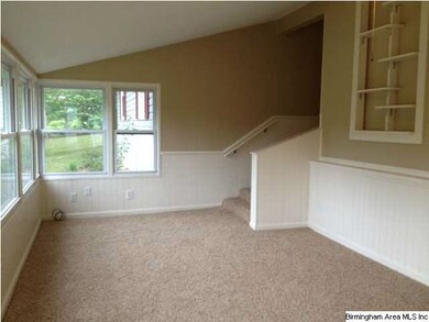Sunken den has new carpeting and paint.