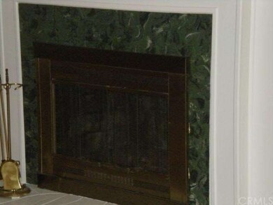 BEAUTIFUL STONE AND BRASS FIREPLACE.