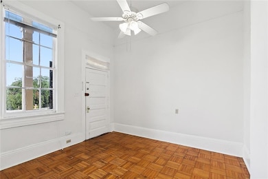 Bedroom has a door to exterior stairs.