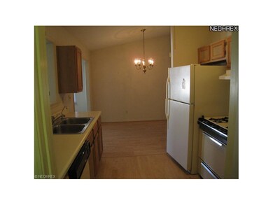 Kitchen into the dining area. Appliances stay.