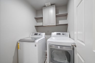 Spacious laundry room with ample storage solutions