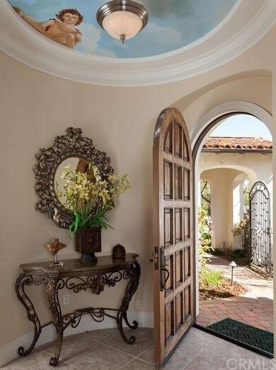 Arched door entry, with stunning painted fresco on